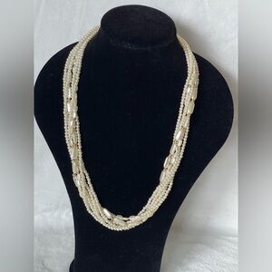 Amazing vintage multi strand, faux pearl necklace. Gold tone.